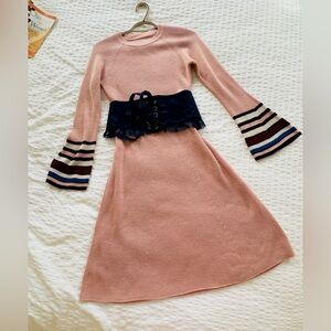 Looks like new knitting pink dress with royal blue belt